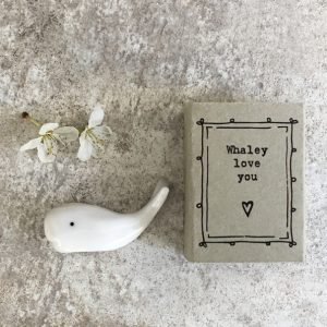 A cute little ceramic whale keepsake in a matchbox with the words Whaley Love you printed on it