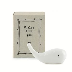 A cute little ceramic whale keepsake in a matchbox with the words Whaley Love you printed on it
