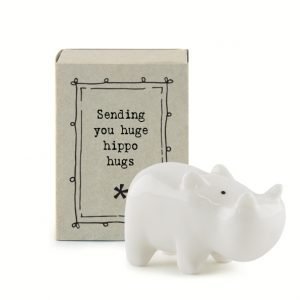A sweet ceramic hippo keepsake in a matchbox with the words sending you huge hippo hugs printed on it.