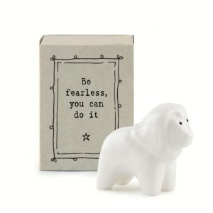 A sweet little lion ceramic keepsake in a matchbox with the words Be Fearless you can do it printed on it.