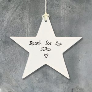 A lovely ceramic star hanging keepsake with the words Reach for the stars printed on it