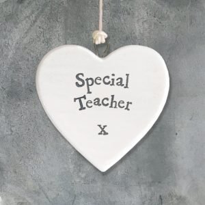 A small ceramic heart shaped keepsake with the words Special Teacher printed on it