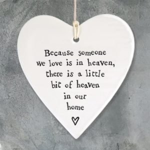 A lovely ceramic hanging heart keepsake with the words Beacuse someone we love is in heaven there is a little bit of heaven in our home
