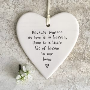 A lovely ceramic hanging heart keepsake with the words Beacuse someone we love is in heaven there is a little bit of heaven in our home