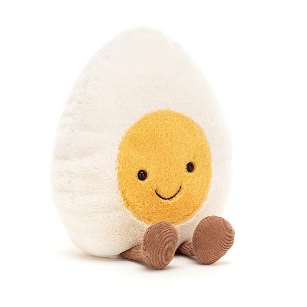 A large cuddly boiled egg with a smiley face and little brown legs