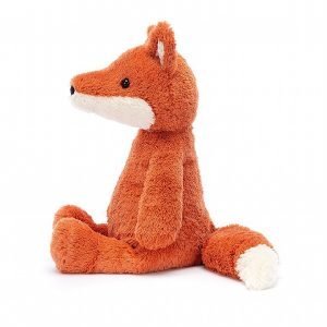 A sweet and very soft ginger fox with a long bushy tail and pointy ears.