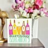 A geordie birthday card for wor kid illustrated with bottles and Happy Birthday Wor Kid