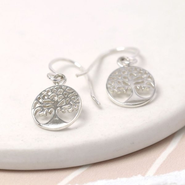 A pair of silver drop tree of life earrings.