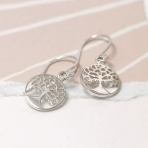 A pair of silver drop tree of life earrings.