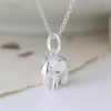 A sterling silver elephant necklace on a fine chain with a charm in the shape of an elephant.