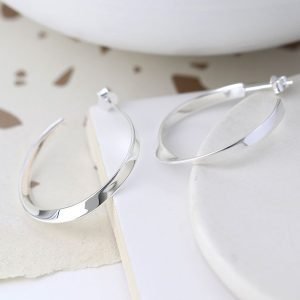A pair of sterling silver hoop sleeper earrings which have a twist effect.