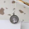 A lovely silver tree of life charm which has marcasite gemstones all the way around it.