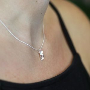 A silver necklace with 3 flying butterfly charm and fine silver chain