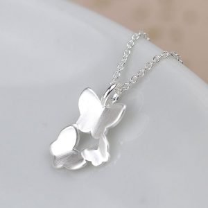 A silver necklace with 3 flying butterfly charm and fine silver chain