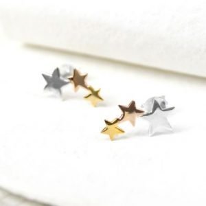 A pair of sterling silver triple star studs that have two of the stars plated in rose gold and yellow gold.