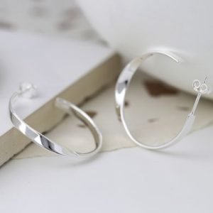 A pair of sterling silver hoop sleeper earrings which have a twist effect.