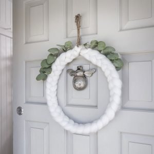 Ivory Wool Chaplet Round Wreath. A ivory wool plated circular chaplet with rope hanger. Geat for hanging on doors or walls