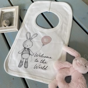 A sweet white bib with a cute bunny holding a pink balloon design