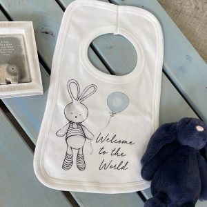 A sweet little bib with an image of a cute bunny holding a blue balloon and with the words Welcome to the World printed on it.