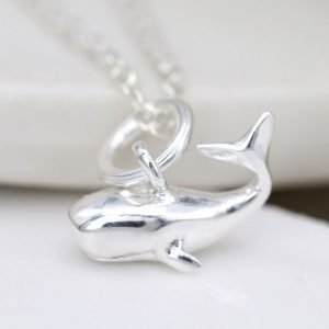 A sterling silver necklace with a little silver whale pendant on a fine silver chain