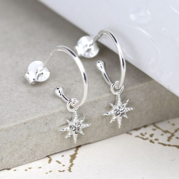 A pair of silver star drop hoops with rhinestones in the stars and an open style hoop with butterfly post fitting