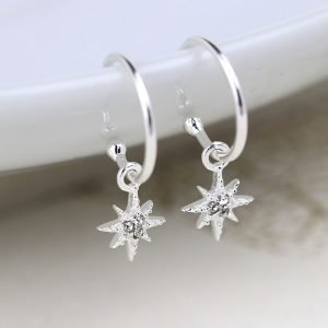 A pair of silver star drop hoops with rhinestones in the stars and an open style hoop with butterfly post fitting