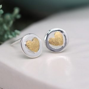 Framed gold heart stud earrings. A small gold plated heart framed in a sterling silver circle