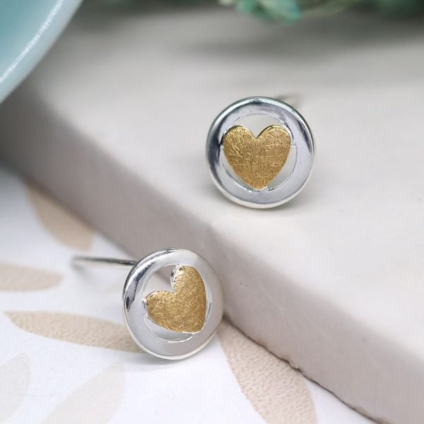 Framed gold heart stud earrings. A small gold plated heart framed in a sterling silver circle