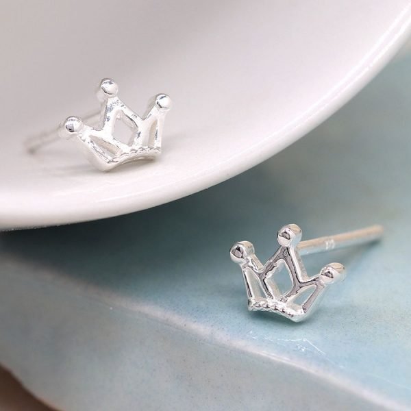 A delicate pair of sterling silver crown stud earrings
