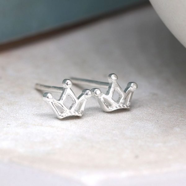 A delicate pair of sterling silver crown stud earrings