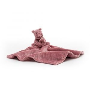A lovely furry pink hippo toy with a square velvety blanket that is rolled up in a ribbon. This lovely pink hippo fuddlewuddle soother is from Jellycat.