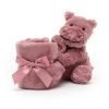 A lovely furry pink hippo toy with a square velvety blanket that is rolled up in a ribbon. This lovely pink hippo fuddlewuddle soother is from Jellycat.
