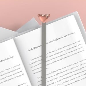 Rose gold heart bookmark on a metal clip.