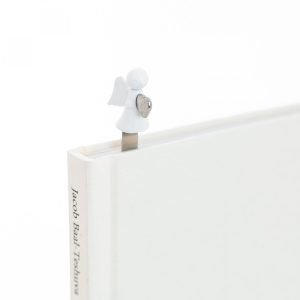 A metal bookmark with a little white angel carrying a silver heart on the top