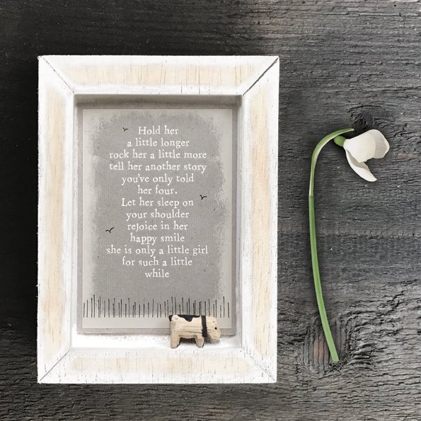 A little wooden picture with a little wooden dog and the words Hold her a little longer, rock her a little more, tell her another story you've only read her 4. Let her sleep on your shoulder, rejoice in her happy smile, she is only a little girl for such a little while