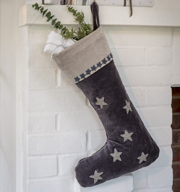 A midnight grey velvet Christmas stocking with embroidered silver bead stars