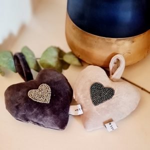 A velvet padded heart in either cream or grey with an embroidered beaded heart