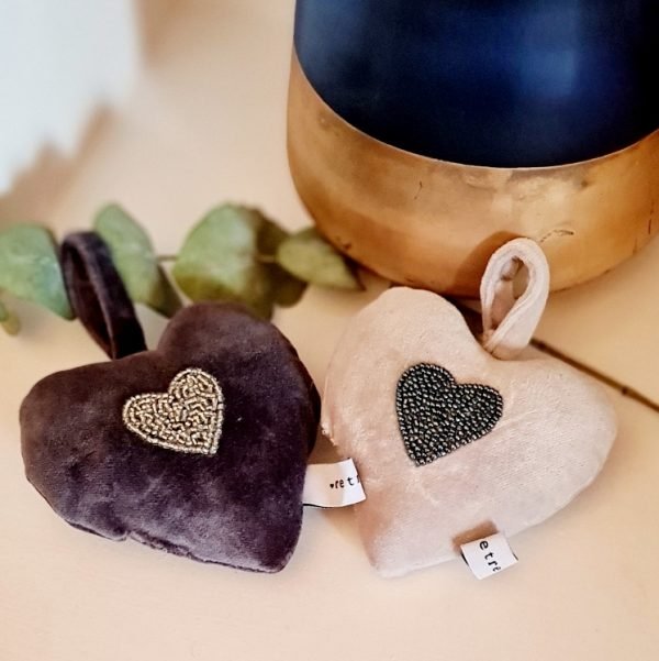 A velvet padded heart in either cream or grey with an embroidered beaded heart