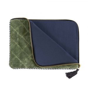 A quilted velvet tablet cover with internal padding, a zip fastening and tassel.