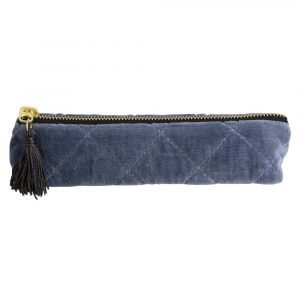 A blue velvet quilted pouch for keeping either pens and pencils or cosmetic brushes in.