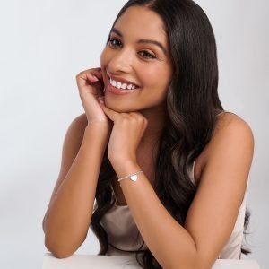 A silver plated stretch bracelet with a lovely silver plated heart charm on it. The bracelet is packaged in Christmas Cracker packaging with gold ribbons at either end.