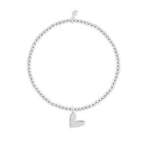 A gorgeous silver plated stretch bracelet with a heart shaped charm on it. The bracelet is presented on a square card with a Christmas sentiment.