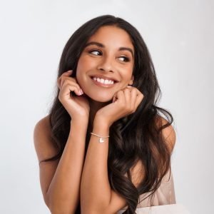 A gorgeous silver plated stretch bracelet with a heart shaped charm on it. The bracelet is presented on a square card with a Christmas sentiment.