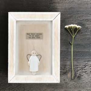 A small wooden frame with a carved wooden angel and the words may there always be an angel by your side