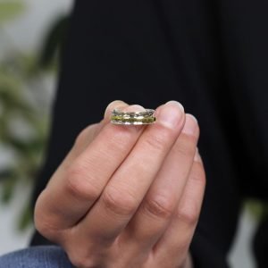 A sterling silver hammered ring with a brass spinning band