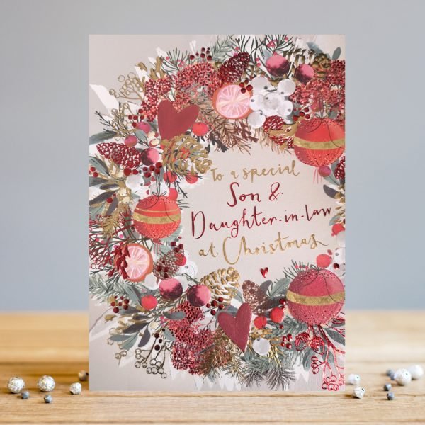 A lovely Christmas card with an image of a christmas wreath and the words To a Special Son and Daughter in law at christmas printed in the centre of the wreath.