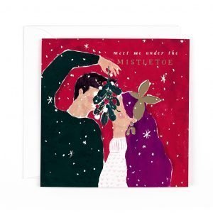 A Christmas card with a couple kissing under the mistletoe. Meet me under the mistletoe