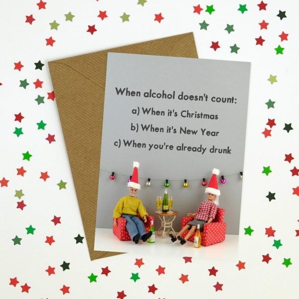 A rude Christmas card with a photograph of a Ken and Barbie doll in their Christmas hats with their drinks. When alcohol doesn't count a. When it's Christmas b. When it's New Year c. When you're already drunk