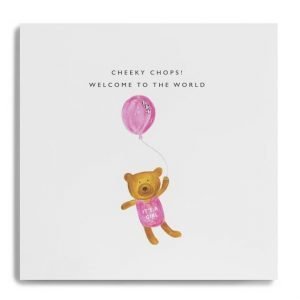 A new baby boy card with a little cute teddy in a pink babygrow with Its a girl. The teddy is holding a pink balloon and the words across the top of the card say Cheeky Chops! Welcome to the world