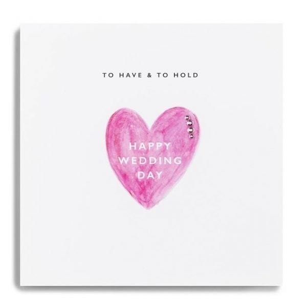 A wedding card with a big pink heart with happy wedding day written inside it and to have and to hold across the top